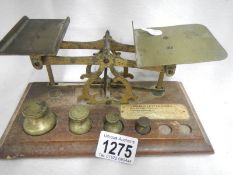 A set of wood and brass postal scales