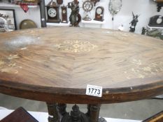 A 19th century oval inlaid occasional table,