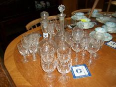 2 decanters and a quantity of drinking glasses