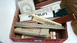 A quantity of rulers and thermometers