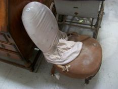 A Victorian mahogany nursing chair for restoration