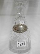 A crystal decanter with silver sherry label HM London 1968