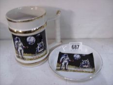 A large mug and a dish celebrating the 1969 moon landing by Prince William ware