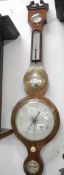 A 19th century wheel barometer with swan neck pediment