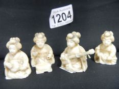 4 ivory seated musicians