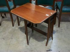 An Edwardian mahogany inlaid Sutherland table