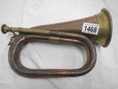A copper bugle marked 'Army & Navy C.S.L.
