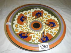 A 12" diameter Gouda dish
