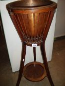 A Victorian mahogany plant stand with copper liner