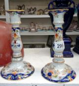 A pair of antique candlesticks (one has repair)