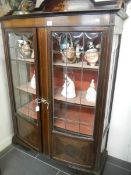An Edwardian inlaid display cabinet with original lined shelves