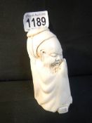 A signed ivory monk in robe