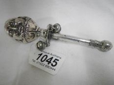 A Victorian white metal babies rattle inscribed Victoria Hayes born 3rd June 1848