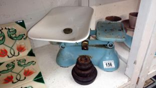 A set of cast iron 'Weylux' kitchen scales and weights