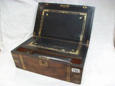 A Victorian writing box with brass banding
