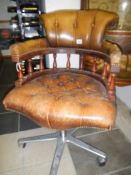 A button seat leather captain's chair
