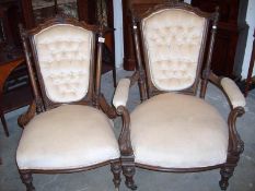 A pair of Victorian arm chairs