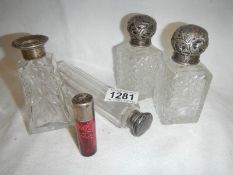 5 silver topped bottles