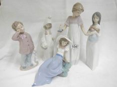 4 good NAO figurines and a Lladro figurine