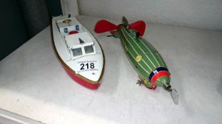 A tin plate clockwork Sutcliffe pilot boat and a Zeppelin airship