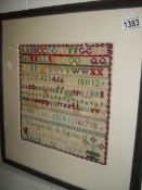 A 19th century framed sampler, sampler 26 x 27cm,