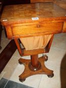 A Victorian sewing table with chess board top and contents