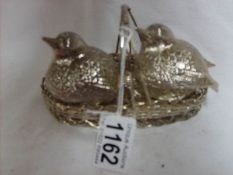 A silver plate birds in basket cruet