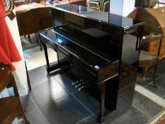 A superb Steinmayer upright piano with metal frame,