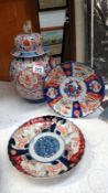 A large a/f Imari jar with cover and a pair of old Imari plates