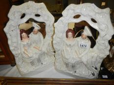 A pair of Staffordshire flat back figures