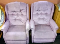 A pair of reclining armchairs