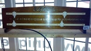 A table top billiard/snooker scoreboard. E.J. Riley
