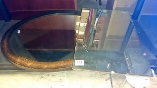 An oval mirror & 1 other