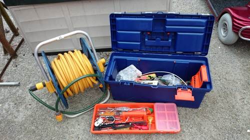 A hose reel & box of tools