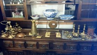 A quantity of brass ware including gong & candlesticks etc.