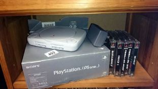 A Play Station one with 5 games