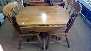 A drop leaf pine table & 2 chairs