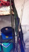 A quantity of fishing rods & net etc.