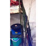 A quantity of fishing rods & net etc.