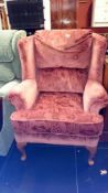 A good quality wing armchair