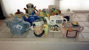 A large quantity of collectors teapots