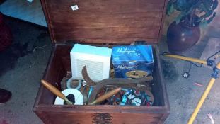 A wooden trunk & tools