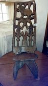 A carved wooden stool/chair