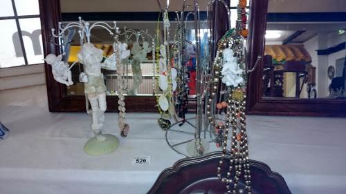 A quantity of costume jewellery on stands