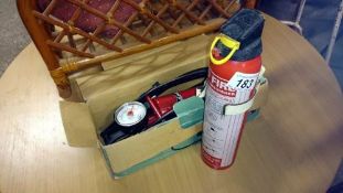 A foot pump & fire extinguisher