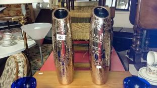 A pair of large silver coloured sloped vases