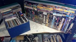 3 boxes of Dvd's & cd's (1 shelf)