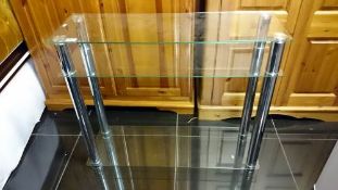 A chrome & glass shelf unit