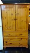 A pine bedroom 2 door 3 drawer cupboard