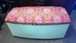 A fabric covered Ottoman